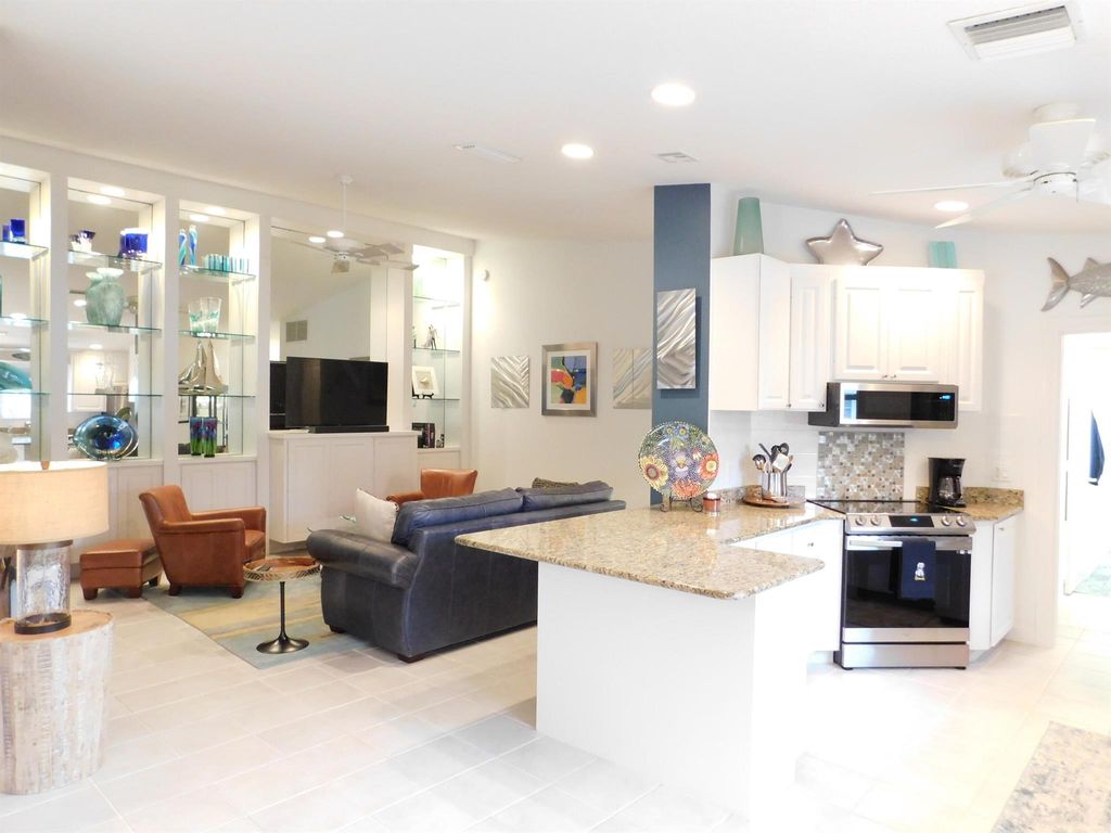 Photo of 1035 SW Tamarrow Place, Stuart, FL 34997 (MLS # R10900881)