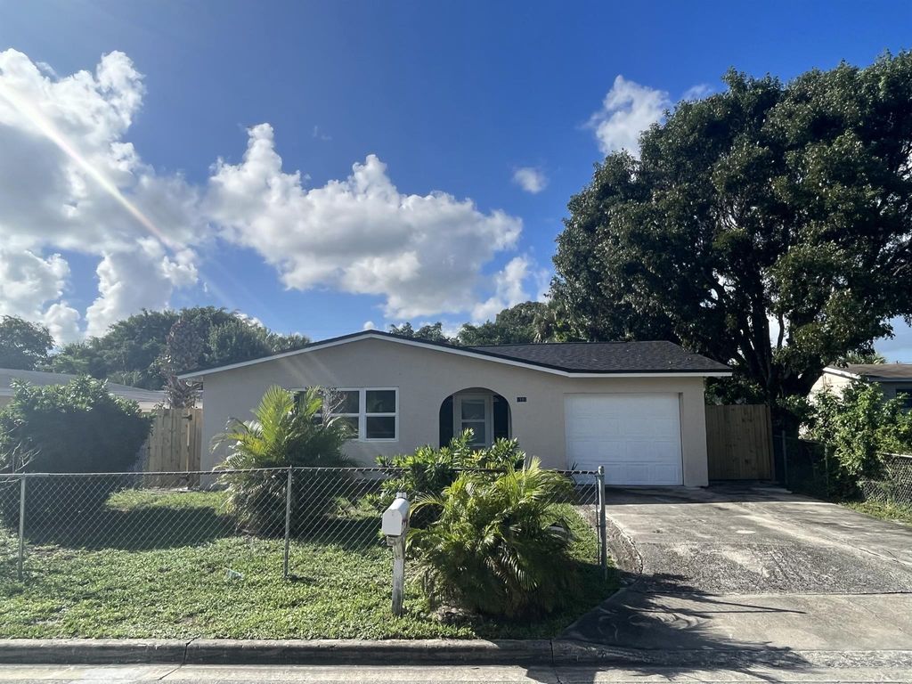 Photo of 1581 W 34th Street, Riviera Beach, FL 33404 (MLS # R10924694)