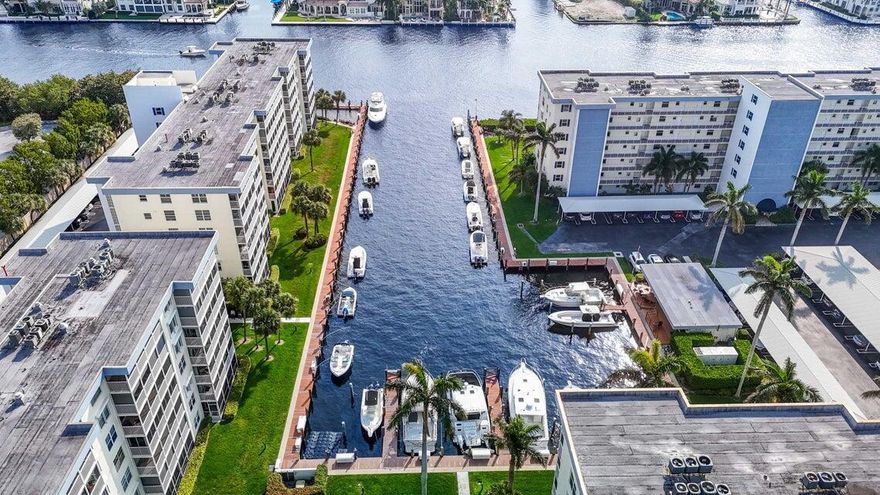 Harbourside - One of Delray's Best-Kept Secrets! Discover Harbourside, a hidden gem on the Intracoastal offering an unbeatable lifestyle in East Delray. This sought-after community features a private marina with boat dockage (check for availability), pickleball and tennis courts, resort-style pool, guest cottage, fitness center, and two clubhouses. Perfectly located—just steps from Publix, Trader Joe's, Fresh Market, Whole Foods, shops, and top restaurants—you'll have everything you need right at your doorstep. This spacious 2-bedroom, 2-bath second-floor residence boasts nearly 1,100 sq. ft. of living space, with a split-bedroom layout and a primary suite that spans one full side of the condo. Enjoy renovated bathrooms, uniform flooring throughout, and a brand-new washer/dry  Step out t0 your oversized patio with serene views of the marina, Intracoastal, and beautifully manicured grounds. Additional features include a dedicated storage unit and plenty of parking.  An incredible opportunity to own in East Delray all for under $450K!