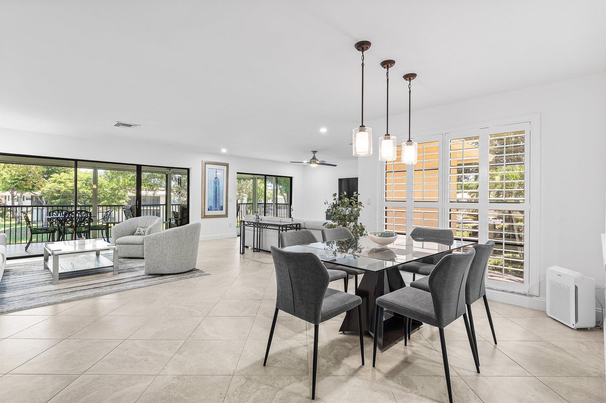 Move-in ready luxury abounds in this recently remodeled residence, set within the park-like settings of Westgate at Hunters Run Country Club. With an expansive 1,778 sqft of contemporary living space, Unit 36-D features 2 Bedrooms plus a flexible den, easily converted to suit your needs as a 3rd bedroom or home office. Notable highlights include porcelain tile flooring, dimmable LED lighting, eat-in kitchen with stainless steel appliances, quartz counters, and custom cabinetry. The primary and guest bedroom suites feature premium carpeting, outfitted closets, and spa-inspired baths with modern vanities & designer fixtures. Unwind to tranquil water views from your private balcony after a day in paradise. Make this your home at Hunters Run today!