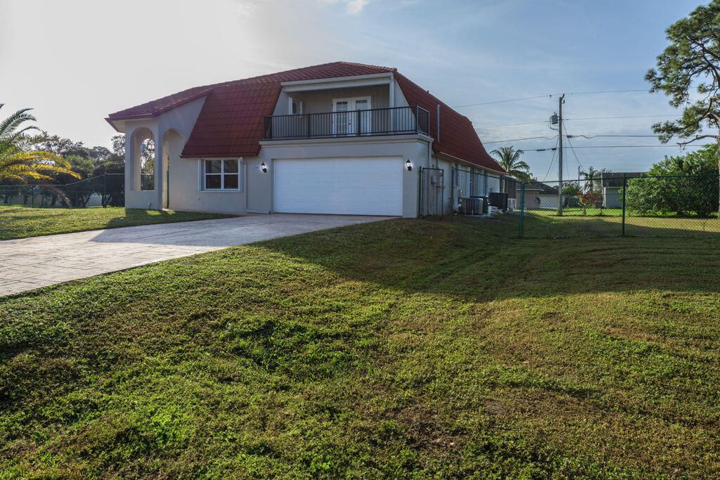 Photo of 1250 SW San Antonio Avenue, Port Saint Lucie, FL 34953 (MLS # R10940287)