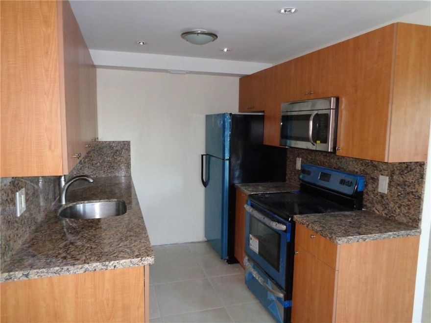 COMPLETELY REMODELED WITH SHOWER STALL, NEW CABINETS THROUGHOUT, GRANITE COUNTER TOPS, BRAND NEW APPLIANCES, PERMITS FOR EVERY CHANGE INCLUDING TANKLESS WATER HEATER. PRICED RIGHT! ASSOCIATION CLAIMS 55+