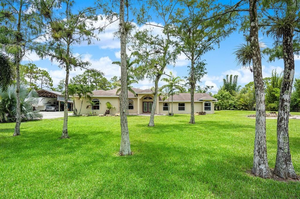 Photo of 16394 E Pleasure Drive, The Acreage, FL 33470 (MLS # R10728860)