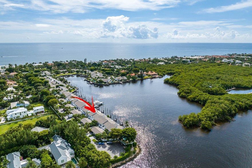 Yachtsman's waterfront dream home. This reimagined luxury townhouse has been renovated from stem to stern. Located in Ocean Ridge gated enclave of Pelican Cove. A rare find with two private, protected dock slips holding a max of two 60' yachts with views of a nature preserve and the intracoastal waterway. Lush landscaping fills the front courtyard entrance leading to a captivating  entrance filled with light, soaring 18' wood ceilings, a state-of-the-art new kitchen and endless water views.  A first floor primary suite with  bespoke closet, dressing room and exquisite bath experience providing the height of elegance.  Upstairs the open gallery leads to two generous guest rooms both ensuite with sparkling water views.Pelican Cove is pet friendly and beach access is steps away