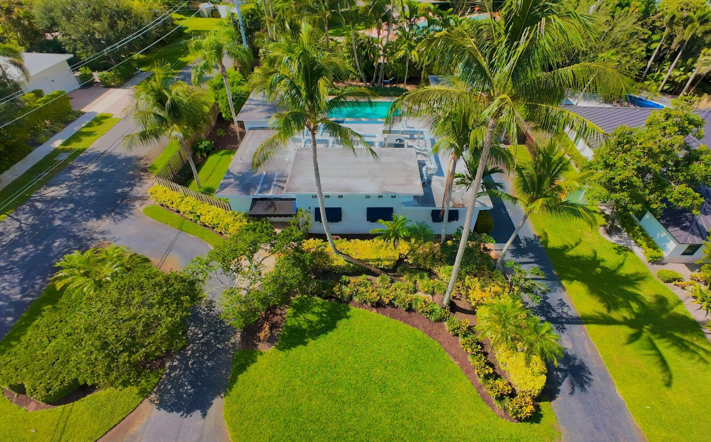 One of the last great lots in Lake Ida! Located minutes from the beach and downtown. This Lake Ida home has it all. The vaulted ceilings and terrazzo floors give this home plenty of charm. An updated kitchen offers granite counters and is equipped with SS appliances along with a gas range. New A/C 2023. The ultra private backyard with pool is perfect for entertaining and enjoying the outdoors. If you're looking to build your next dream home this is it. Perfect and private corner lot with almost 14,000sqft.