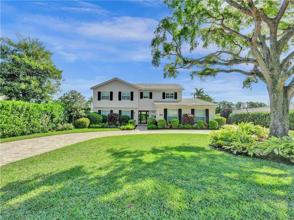 Welcome to this special home on one of the prettiest streets in Fort Lauderdale. This Coral Ridge beauty sits on an almost 18,000 sq foot lot!! Great curb appeal with the house set far back from the street and one of the largest backyards you will ever see. A huge pool, tons of patio space, and an insane amount of grass (with a well for free sprinkler water!). This large house offers over 3500 sq feet of living space plus a large 2 car garage. First floor primary suite with sitting area overlooking the pool and yard, beautiful bath, and 2 generous closets. Large open living space with lots of natural light. Four large bedrooms upstairs sharing two baths. Hurricane impact windows and doors, all PVC sewer lines, newer baths, wood floors and so much more.