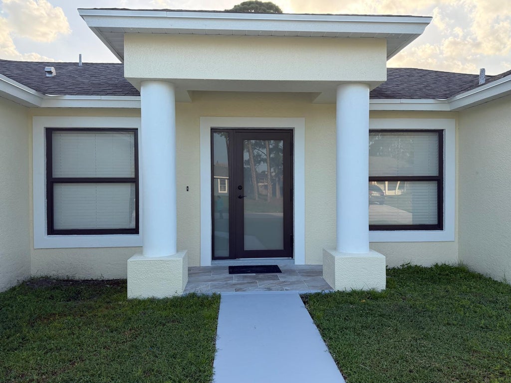 Photo of 1566 SE SUTTON Street, Port Saint Lucie, FL 34983 (MLS # B26065829)