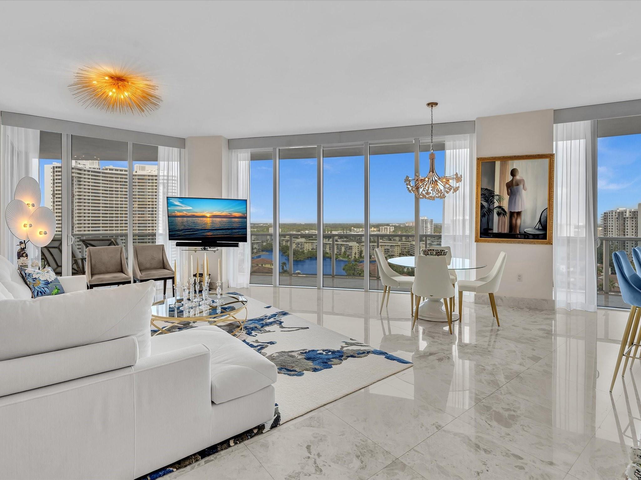 Luxury 3 bed/3 bath flow-through residence Bellini, Williams Island’s newest, exclusive tower. A private elevator opens to 2,235 sf of refined living with polished marble floors, and floor-to-ceiling windows with panoramic Intracoastal views. Each room opens to a wraparound balcony. The Split plan offers spacious suites. Lavish master suite with custom closets, master bath marble and gold fixtures, double vanities, glass shower, jacuzzi and private lavatory. The European style kitchen has Italian cabinetry, granite counters, Sub-Zero - Miele appliances, wine cooler. A boutique building, only 70 homes, offers personalized services: valet, fitness center, Pilates studio, pool, and full access to Williams Island’s 27,000 sf spa, tennis/pickleball courts, two marinas, and waterfront dining.