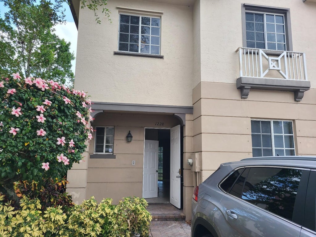 Photo of 1228 LUCAYA Drive, Riviera Beach, FL 33404 (MLS # B26082289)