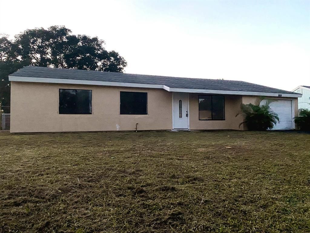 Photo of 1922 SE Burgundy Lane, Port Saint Lucie, FL 34952 (MLS # R10756528)