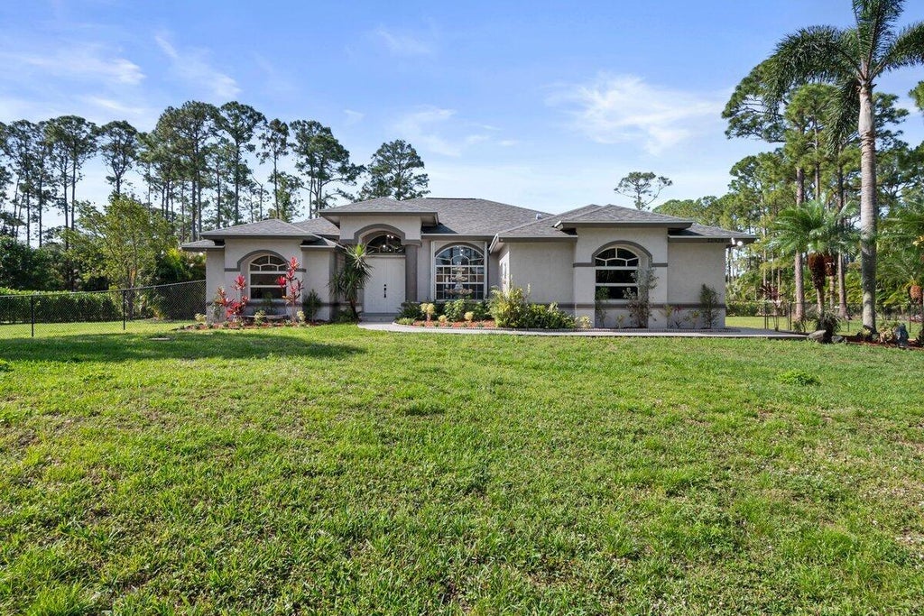 Photo of 13928 Citrus Grove Boulevard, West Palm Beach, FL 33412 (MLS # R11080789)