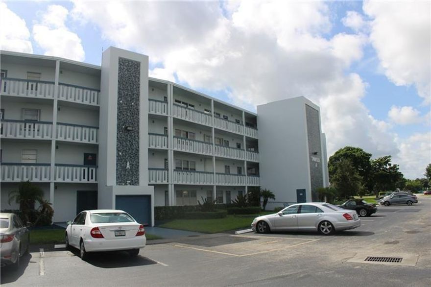 Gorgeous condo totally remodeled, open concept, everything is new! see pictures with this amazing kitchen and living/dining area. New bathrooms, all impact windows and doors. Incredible, glassed in balcony, gives you an extra Florida Room. This building is the first after entrance on the left, so very close to clubhouse, house of worship, and Gard house. All the beloved Amenities in this community will envy your friends and family. Close to the Beach and all your daily shopping needs. All new Furniture's are negotiable. Easy to show to qualified buyers.