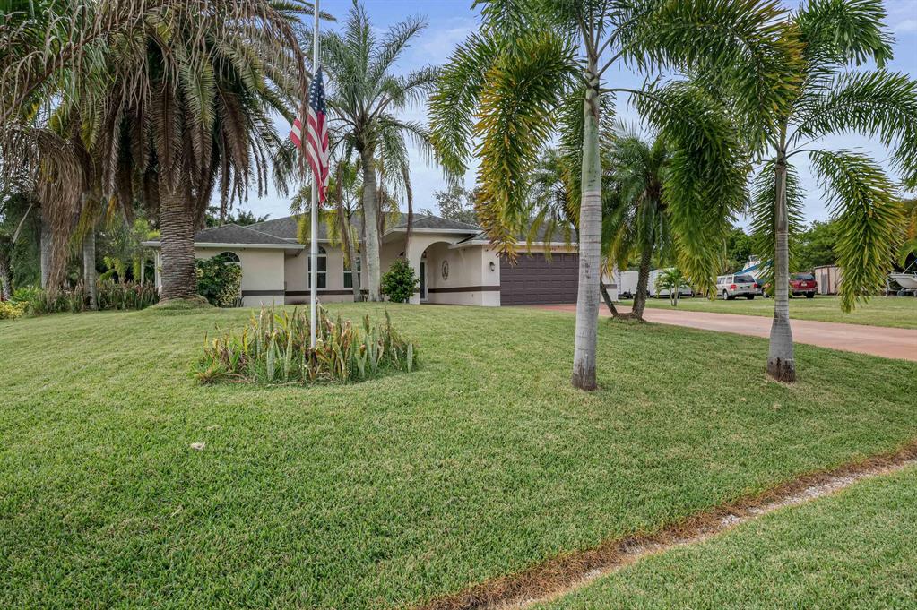 Photo of 4090 SW Jaqust Street, Port Saint Lucie, FL 34953 (MLS # R10761394)