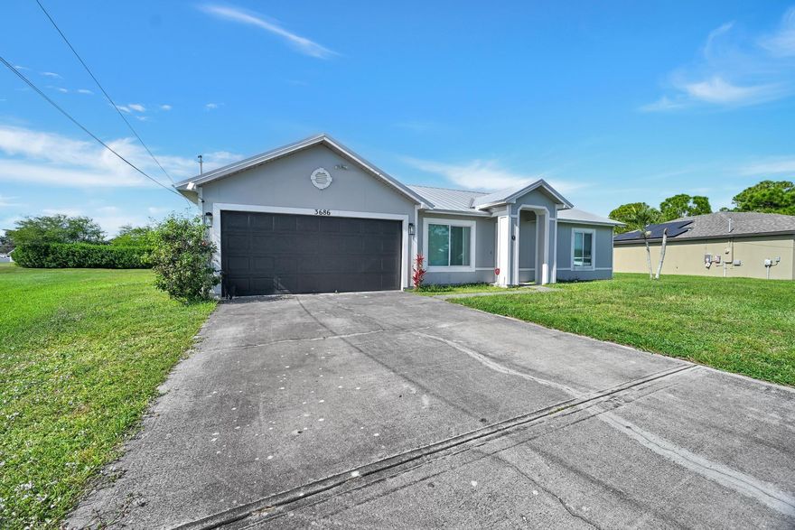 OVER SIZED LOT. IMPACT WINDOWS! METAL ROOF! AC 2023! Welcome home! This charming 3-bedroom, 2-bath residence sits on an oversized lot in a highly desirable location. Enjoy an open and inviting floor plan perfect for everyday living and entertaining. Spacious yard. Conveniently located near shopping, dining, and major highways.