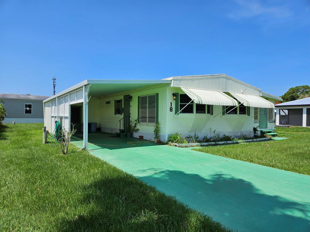 Photo of 18 Reforma Ln, Port St Lucie, FL 34952 (MLS # R10902502)