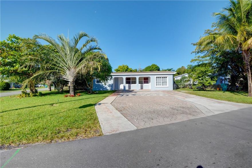 This 4 bedroom, 3 full bathroom home sits on a huge corner lot with tons of privacy. Garage has been converted into a 4th bedroom with full bathroom. It has a private entrance and could be used as a separate apartment. Florida room was also converted into a bedroom with a full bathroom. This home is perfect for growing family or a multigenerational family. It would be perfect for a landlord looking to rent 3 separate units under one roof. Tile floors throughout. Driveway large enough to accommodate up to 9 cars. The large yard  has several fruit trees including Sour Sop, Mango, and Ackee trees.