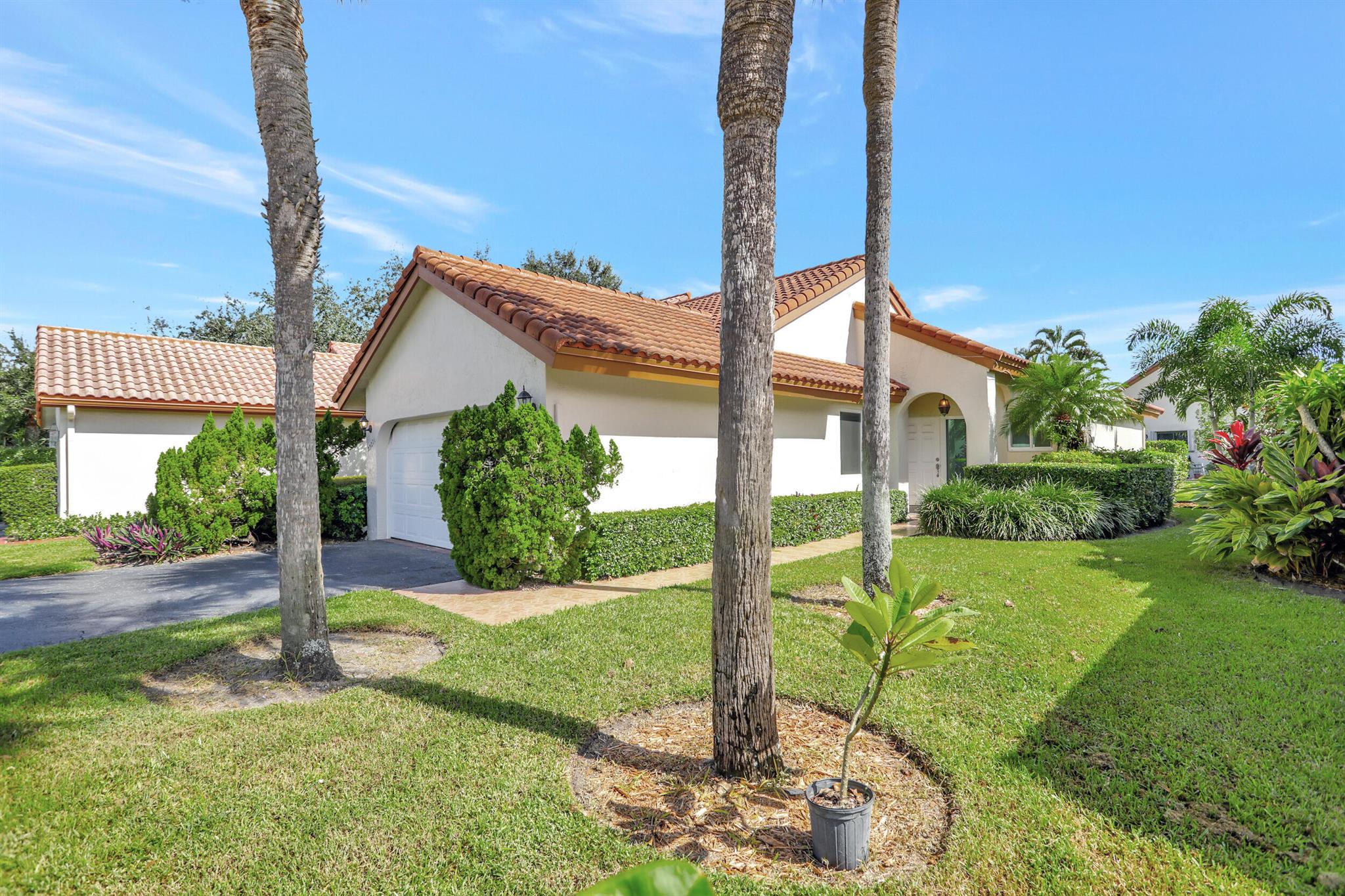 Welcome to this fully upgraded home in the beautiful and gated community of Waterside. This home has a modern open living area with high ceilings enhanced by natural lighting from skylights in both the living room and kitchen. The kitchen features new cabinets, quartz countertops, stainless steel appliances, and updated fixtures.Main bedroom has a large walk-in closet, access to screened patio, and blackout shades. All bathrooms have been tastefully updated. Impact glass and thermal blinds throughout the home provide energy efficiency, lowering cooling and insurance costs. Ceramic tile flooring has the look of hardwood. New water tank, 5-year-old roof, 3-year-old A/C unit.Relax and enjoy outdoor living space in the screened in patio with garden view.