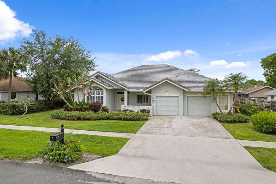 This is the home you have been waiting for...Yes...4 bedrooms, 3 baths, PLUS a den pool home  in one of the most sought after neighborhoods in Wellington...Chatsworth Village. It gets better...a brand new concrete tile roof installed May 2025! Step into this fantastic home with an exceptional 3-way bedroom split floor plan offering a large updated Master Bedroom and Bath on one side, two bedrooms and a bath on the opposite side and a 4th bedroom and full bath/ cabana bath off the backside/family room.  As you enter the foyer...you have a office/den with custom built-in cabinetry and shelving  directly to your right. There is newer tile flooring throughout the formal living and dining room, family room and kitchen. Beautiful plantation shutters throughout, French doors off the...    ...  living room, family room and master bedroom and added other details such as high vaulted ceilings, chair rail in formal dining room, spacious interior laundry room with added storage, heated pool/spa with a  screened 38 x 37 patio, fenced yard...and much more! The kitchen is truly the heart of the home centrally located with a breakfast area, bar counters and overlooking a large open family room.  The screened pool/patio offers a wonderful extension for entertaining... an oversized pool with swim outs and elevated spa with over pour to the pool. Wait until you see the Primary Bathroom...an amazing coastal renovation from wood plank tile, seamless shower doors, new tile, fixtures, soak tub, new vanity...you name it no expense spared...you have to see it!!! Such a quiet neighborhood with one way in and out, community park/playground overlooking a 55 acre Lake Greenview offering boating, kayaking, fishing, sailing or just sitting on the bench watching incredible sunsets. The neighborhood hosts an Annual BBQ and other fun events! Excellent schools!! Close to all equestrian events and International Polo, great shopping and fine dining...do not miss this one...this house sells itself!