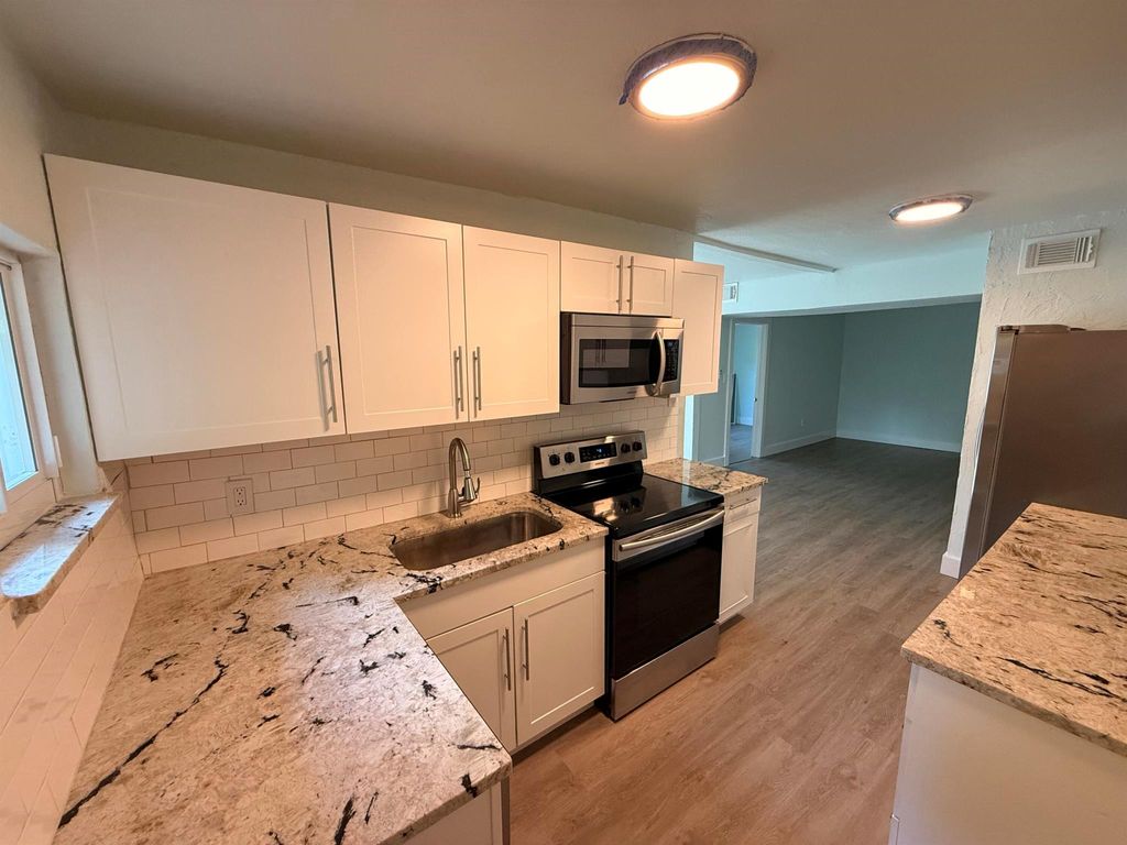 Photo of 508 Palmetto Street, West Palm Beach, FL 33405 (MLS # R11126465)