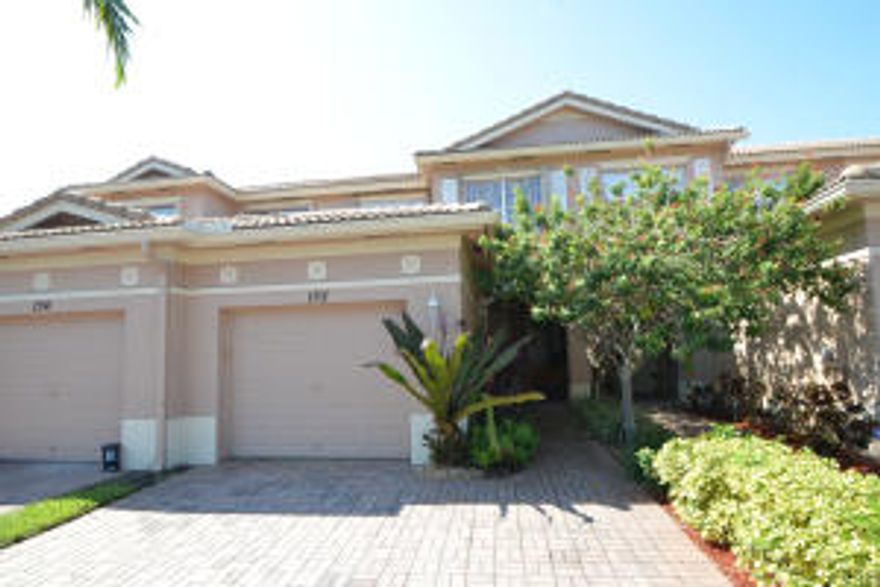 Gorgeous tropical 3 2.5 townhome, serene water view, top of the line light fixtures and window treatments, lightly used by show birds.  Near downtown and turnpike.  A winner!