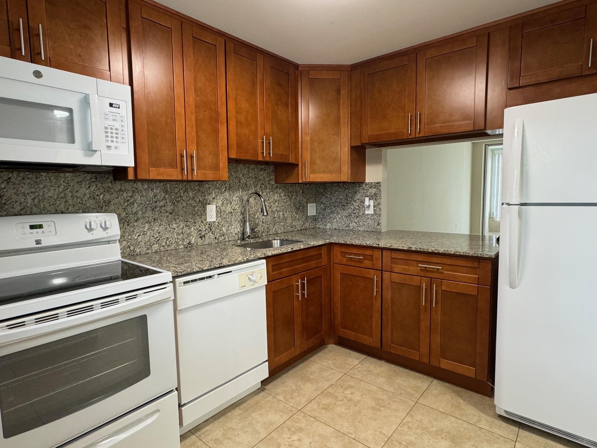 Great location in Tamarac, updated 1 bedroom 1.5 bathroom, tile throughout, updated kitchen cabinets, white on white appliances and granite countertop. Water, cable and monthly pest control is included in the rent. Building has an elevator and laundry facilities. Unit is ready for a new tenant. Second floor condo with golf and garden view from the balcony. Assigned parking and plenty of guest parking available. Just a short drive to restaurants, shops and major highways.
