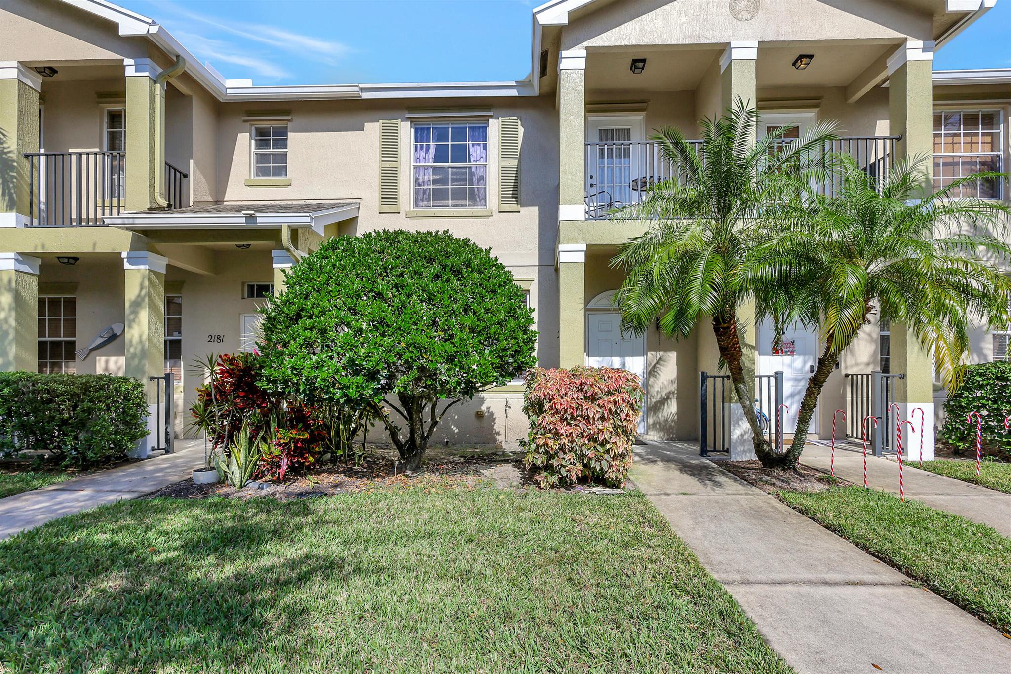 JUST REDUCED! MOTIVATED SELLER! New roof coming! Enjoy this cozy 2-story townhouse in the delightful East Lake Village community. This 2 bedroom, 2.5 bathroom features a 1-car garage, eat-in kitchen, tray ceilings in the bedrooms, and a balcony in the master bedroom to enjoy your morning coffee. The main level is tile throughout, the stairs and upper level carpeted for comfort. Washer and dryer in the unit. The community offers a pool and lovely walking trails. Pets are welcome with some restrictions. Close to schools, dining and shopping. The ocean is just 8 miles away! HOA covers lawn maintenance, cable, internet, phone, and pest control.