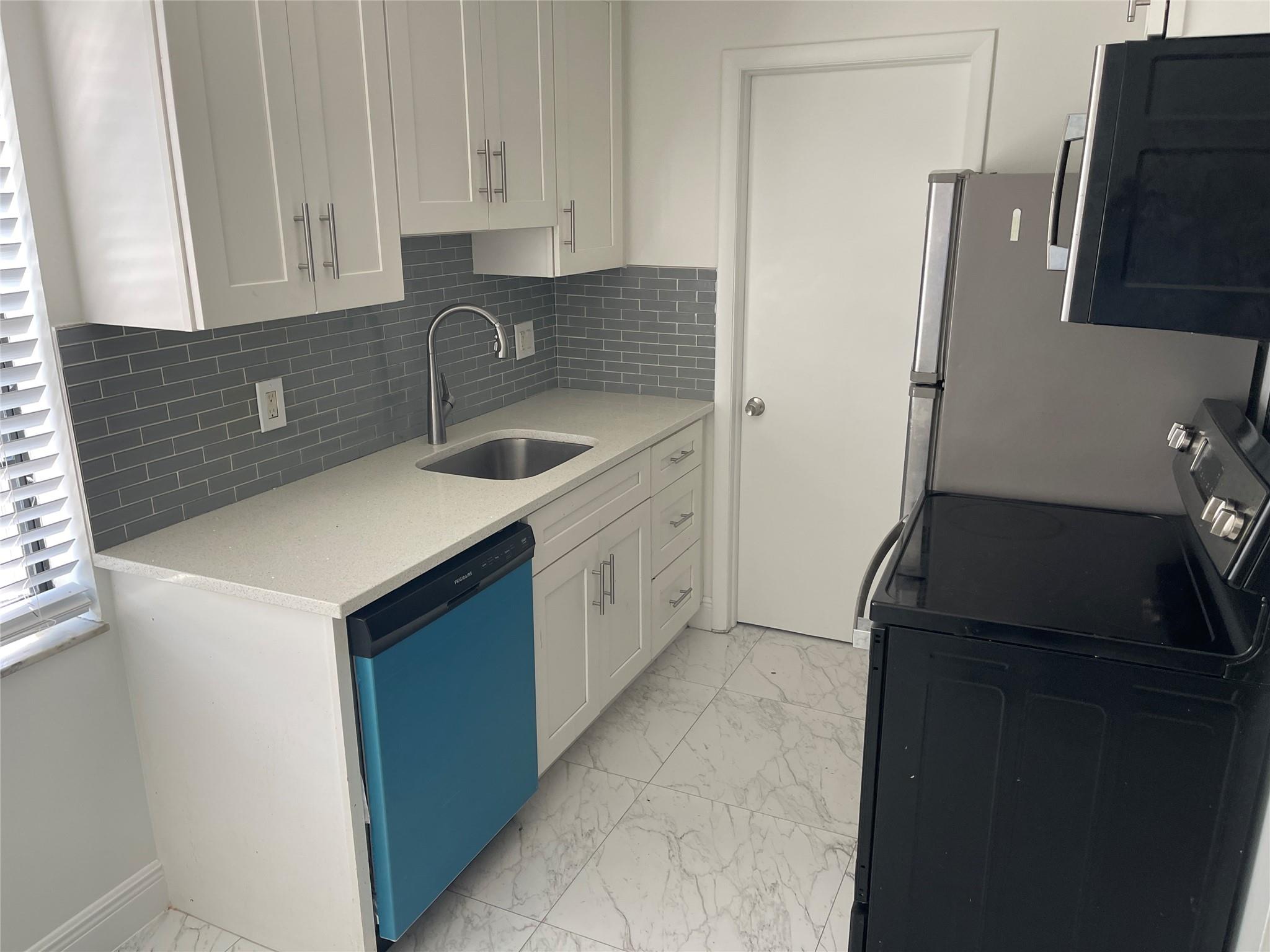 This beautifully updated 2-bedroom, 1-bathroom rental offers modern living in a convenient location. The home has been thoughtfully remodeled with stylish tiled floors throughout, giving it a sleek, low-maintenance appeal. The updated kitchen features contemporary finishes and appliances, making meal prep a breeze. Enjoy the added convenience of your own washer and dryer, eliminating trips to the laundromat. The space is kept cool and comfortable year-round with central A/C. With plenty of parking available, you’ll never have to worry about finding a spot. Plus, the property is ideally located, offering easy access to everything you need—shopping, dining and entertainment ust minutes away. This move-in ready rental is perfect for those seeking comfort and convenience in a prime location.