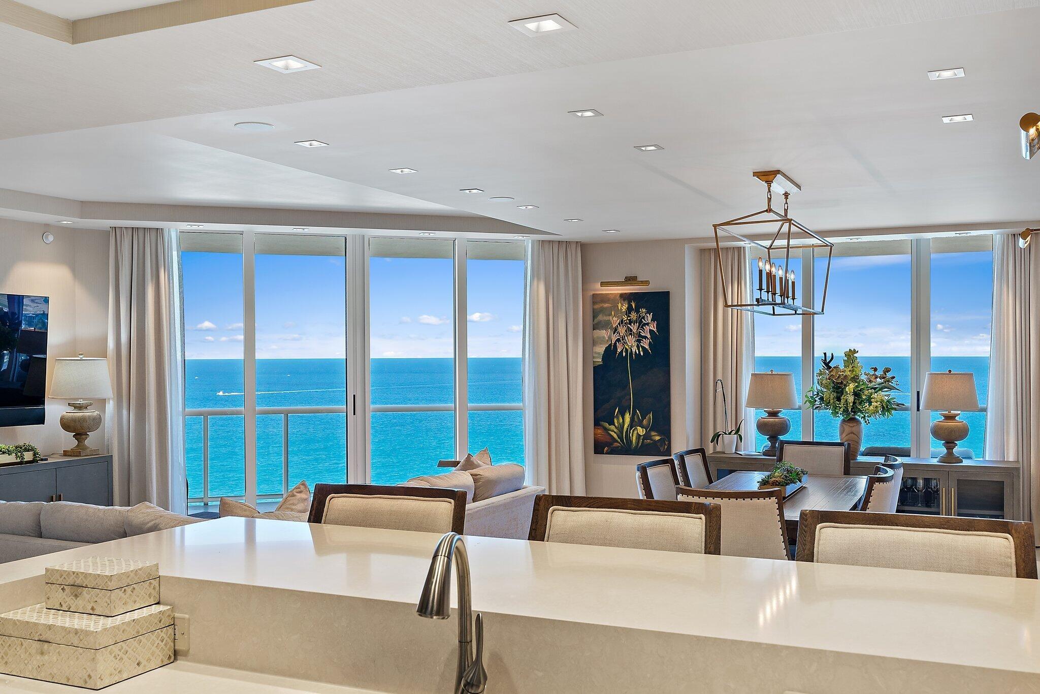 Enjoy island life with these breathtaking views from every room of this 23rd floor exclusive residence. This luxurious 2 bedroom plus den and 3 bathroom condo offers an expansive wrap around balcony overlooking the Atlantic Ocean, Singer Island, the Intracoastal waterways, all the way to Palm Beach Island. Well-appointed and beautifully furnished throughout, this residence offers an oversized living and dining area, an adjacent den that can be used as office and split floor plan bedrooms. The gourmet kitchen features Italian cabinetry, an open floor plan concept and state of the art appliances. Wake up to the pristine blue ocean and enjoy the luxurious private owner's suite. The premier Ritz Carlton lifestyle includes direct beach access, an expansive resort pool and oceanfront lagoon