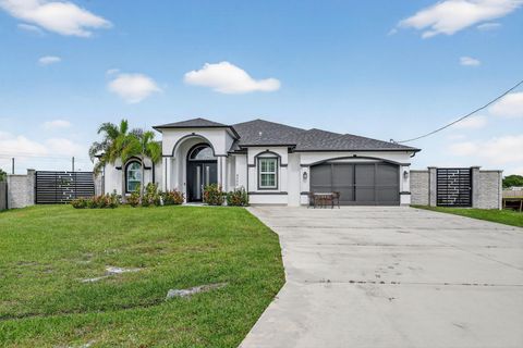 Photo of 4300 SW Attlee Street, Port St Lucie, FL 34953 (MLS # R11136469) Photo of 4300 SW Attlee Street, Port St Lucie, FL 34953 (MLS # R11136469)