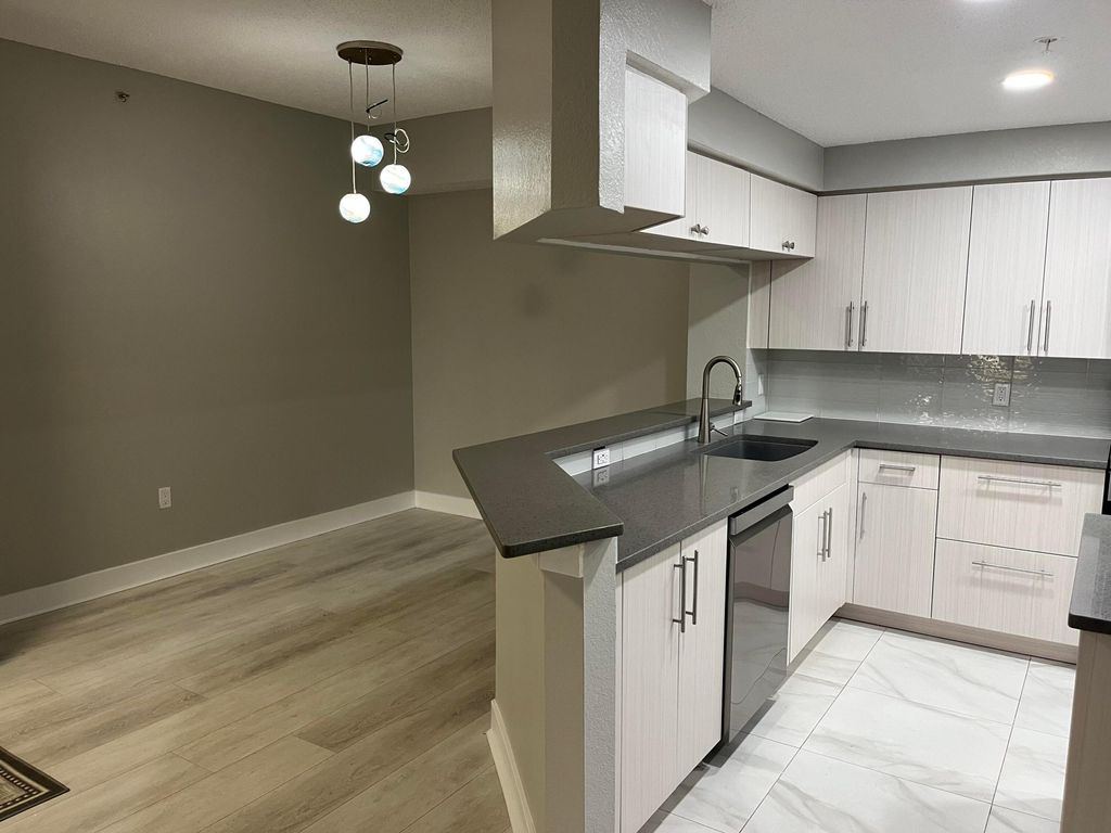 Photo of 3021 Alcazar Place #103, Palm Beach Gardens, FL 33410 (MLS # R11167428)