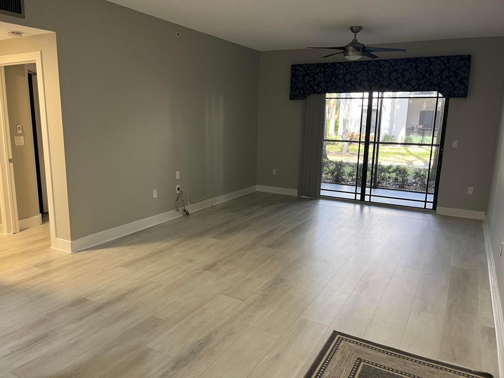 Photo of 3021 Alcazar Place #103, Palm Beach Gardens, FL 33410 (MLS # R11167428)
