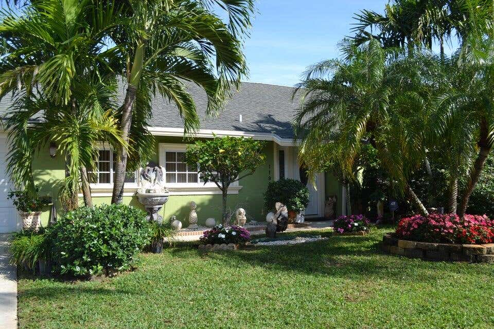 Photo of 1190 Woodcrest Road W, West Palm Beach, FL 33417 (MLS # R11081603)
