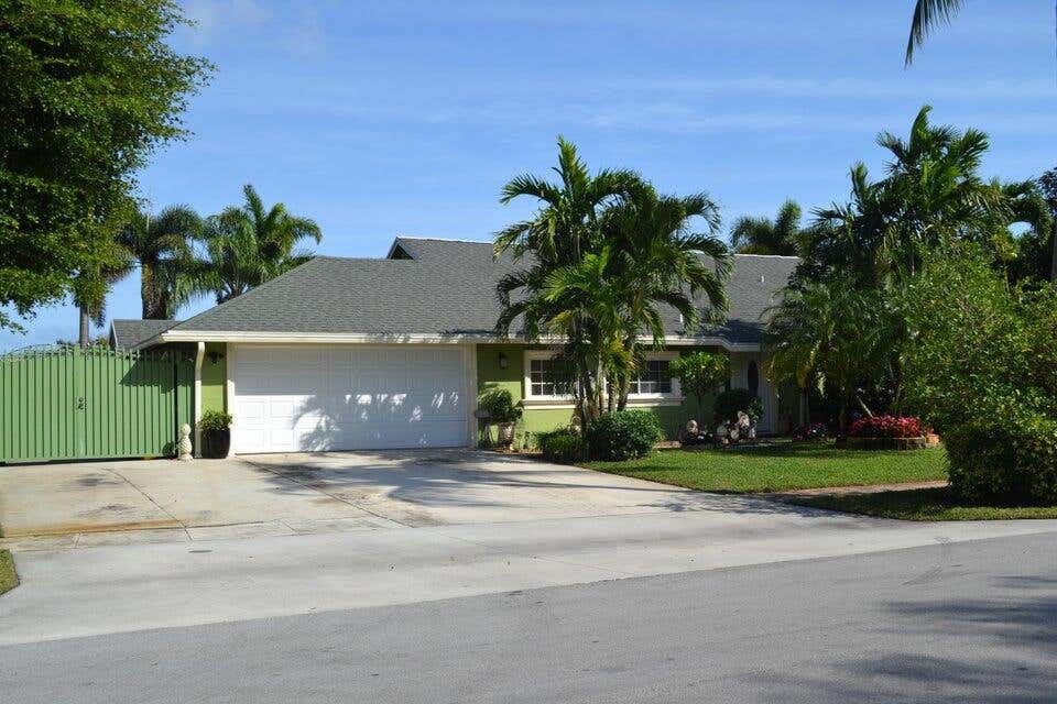 Photo of 1190 Woodcrest Road W, West Palm Beach, FL 33417 (MLS # R11081603)