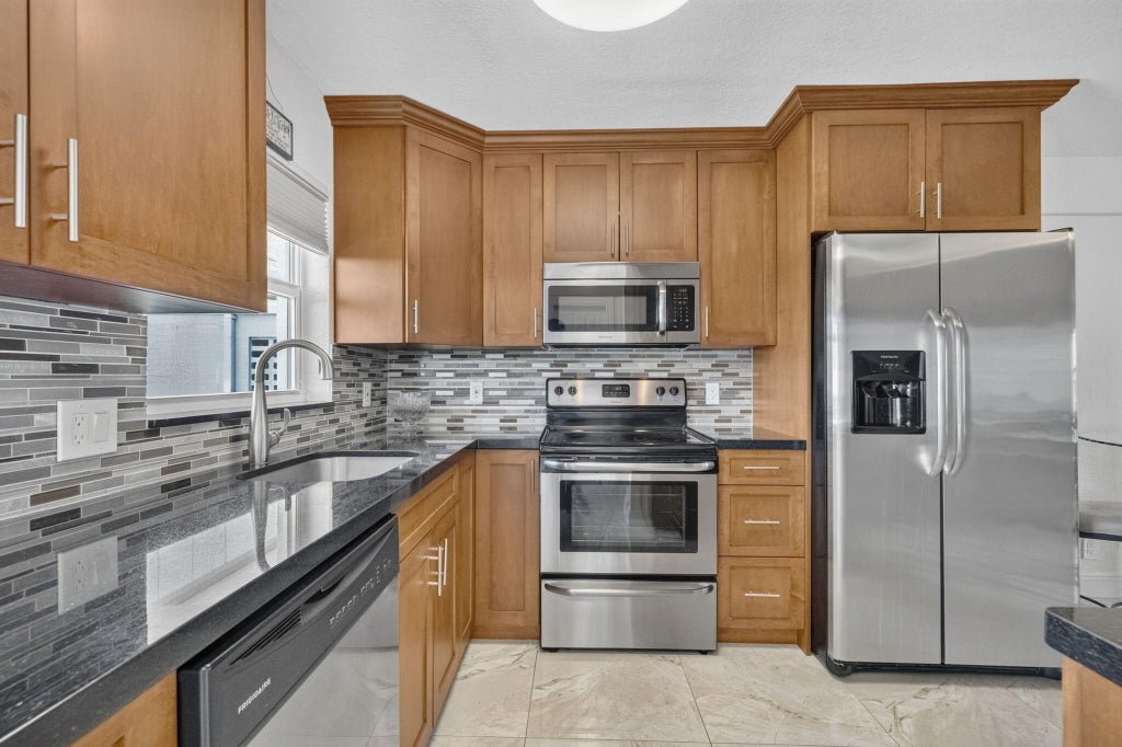Photo of 1536 SE 15th Court #704, Deerfield Beach, FL 33441 (MLS # B26049837)