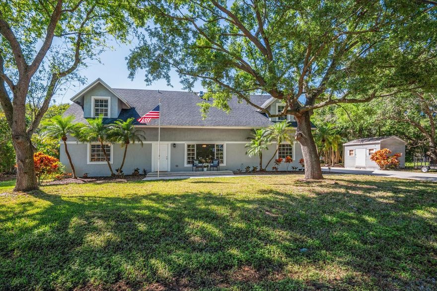 *PRICE IMPROVEMENT:* Welcome to this beautiful home located in the prestigious North Plantation Acres neighborhood. Set on nearly an acre of land, this exclusive single-family residence spans approx. 3,840 sq. ft. & features lush landscaping w/ majestic oak trees, offering the perfect blend of charm and comfort. Inside, you'll find 4 bedrooms, plus a den w/skylights & 2 full bathrooms. The kitchen boasts attractive granite countertops & new SS appliances. The open floor plan creates spacious living areas filled with natural light, featuring laminated hardwood flooring & new carpeting throughout. For entertaining family & friends, the screened-in patio includes a 15x30-foot lap pool. The interior & exterior have been freshly painted & the roof was replaced in 2018. NO HOA! Ready to Move-In!