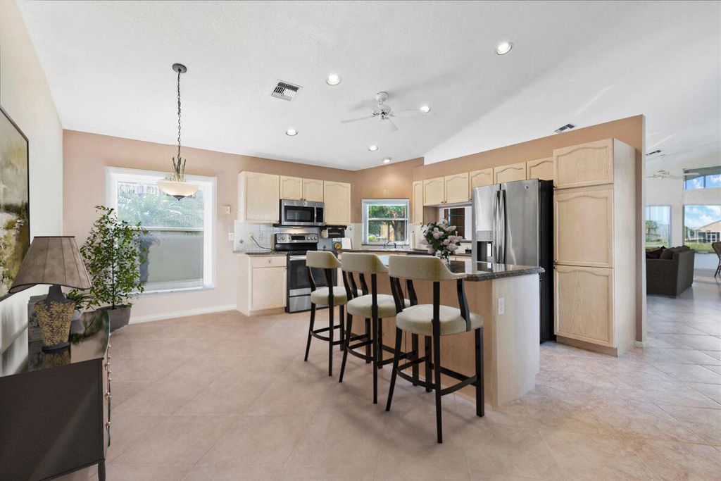 Photo of 117 Harbor Lake Circle, Greenacres, FL 33413 (MLS # R10967458)