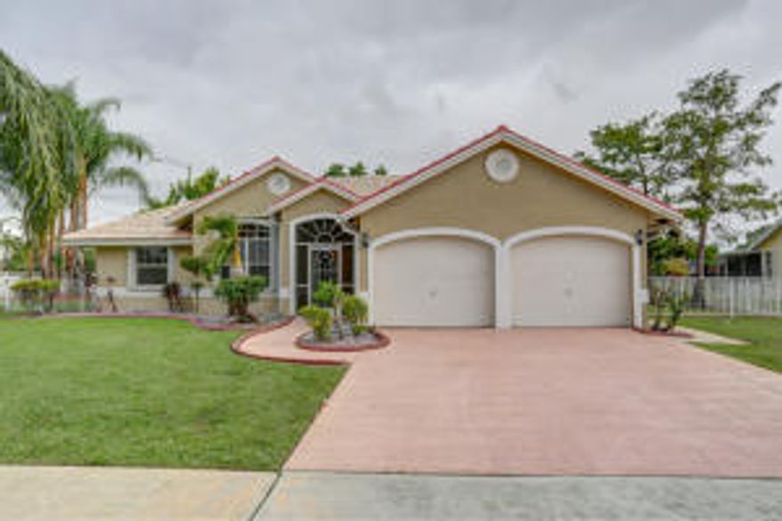 Immaculately clean 3/2 corner property with canal views from a large rear patio for maximum year round enjoyment. The backyard has multiple fruit trees including mangoes, avocados, ackee, lime, banana, papaya and much more. The kitchen features granite countertops and stainless steel appliances. 
THIS PROPERTY WON'T LAST!!!!!