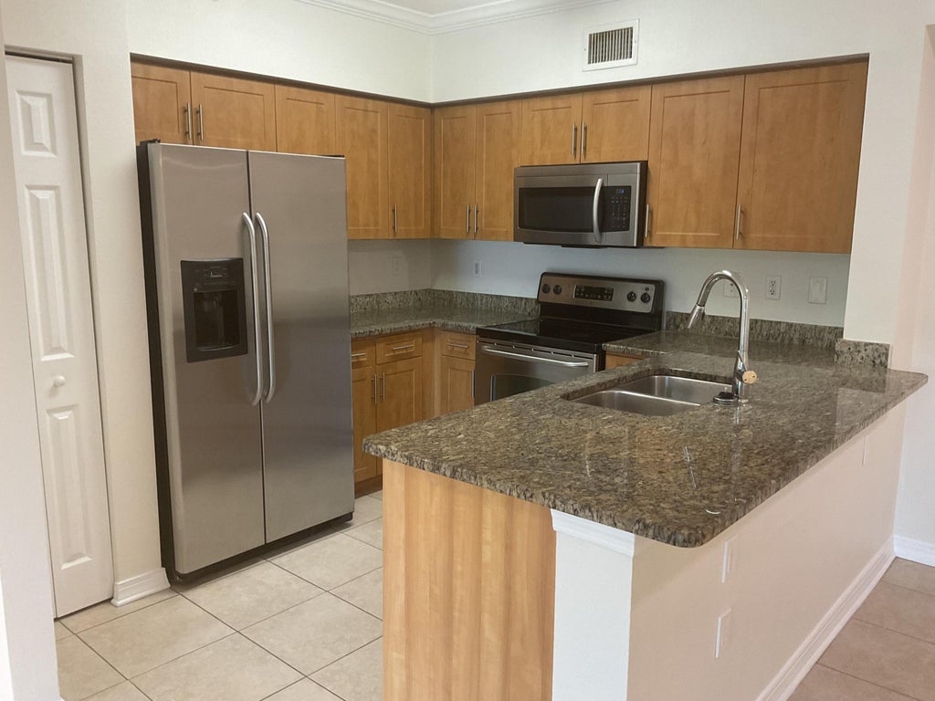Photo of 6505 Emerald Dunes Drive #204, West Palm Beach, FL 33411 (MLS # B26074999)