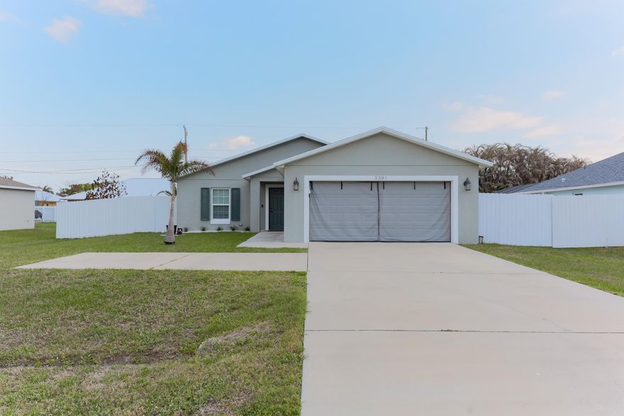 Built in 2019, this 3-bedroom, 2-bath home sits on an oversized 10,000 sq ft lot in a growing and desirable area of Port St. Lucie. Offering a combination of newer construction and outdoor space, the property provides both comfort and long-term potential! Inside, the home features a modern layout with open living areas, plenty of natural light, and a 2-car garage! The backyard is a standout, featuring a custom stone seating area and rock pathway—creating a unique space to relax, entertain, or enjoy evenings around a fire pit. With this lot size, there is plenty of room to add a pool, outdoor kitchen, garden, or expand the outdoor living area! Conveniently located near Becker Road and just minutes from Tradition. Book a showing today!