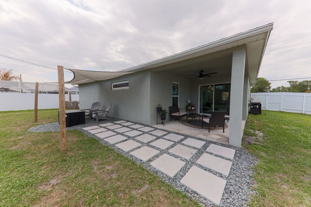 Photo of 3391 SW Rosser Boulevard, Port Saint Lucie, FL 34953 (MLS # B26008312)