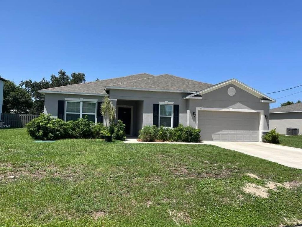Photo of 977 SW Nichols Ter, Port Saint Lucie, FL 34953 (MLS # R11065667)