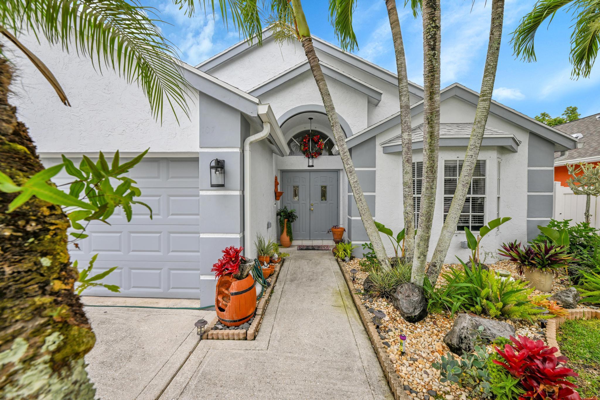Welcome to your private retreat in the heart of Royal Palm Beach! This beautifully maintained 3-bedroom, 2-bath home sits on an oversized lot in the highly desirable Saratoga Lakes community-- and a brand-new roof installed in 2022 for peace of mind. Newer hot water heater and HVAC system too. Step inside to an open, airy floor plan filled with natural light, sleek ceramic tile throughout, and new impact windows that offer both safety and energy efficiency. The split-bedroom layout provides comfort and privacy, while the spacious living areas flow seamlessly for everyday living and entertaining.Enjoy your morning coffee or host weekend gatherings in the screened-in patio, overlooking your fully fenced yard--perfect for pets, play, or future pool plans. The oversized driveway.