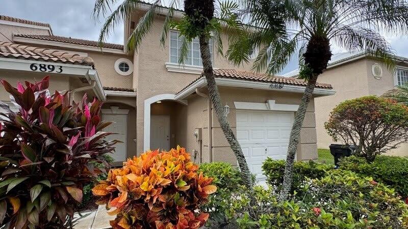 Discover the epitome of serene living in this exquisite, gated townhouse. Nestled in the heart of desirable West Lake Worth, this three-bedroom, two-bathroom home offers the perfect blend of comfort and luxury. Step inside to find a beautifully maintained interior featuring new carpets upstairs and elegant tile floors downstairs. The spacious kitchen, adorned with solid wood cabinets, overlooks the inviting living area. Unwind on the large, screened-in patio, where breathtaking water views create a tranquil oasis. Immerse yourself in the beauty of the waterfront, while enjoying the peace and privacy of this gated community. With its prime location, this home provides easy access to top-rated A-rated schools and a wide range of amenities.