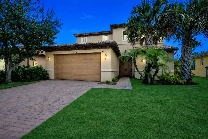Experience refined living in this beautifully designed Berkley Model home located in the highly sought-after community of TownPark at Tradition. Offering 4 bedrooms, 2.5 bathrooms, and a thoughtfully designed layout, this residence blends comfort, functionality, and style in one of Port St. Lucie's premier gated communities. Step inside to discover a spacious open-concept floor plan ideal for both everyday living and entertaining. The home features bright and inviting living and dining areas, complemented by thoughtful upgrades throughout. The kitchen offers ample cabinetry and counter space, seamlessly connecting to the main living areas. Recent enhancements add both comfort and efficiency, including a new, water-efficient half bath toilet (installed 6 months ago), along with an updated mirror and added wall shelving. New light/fan fixtures have been installed in both the downstairs bedroom and one of the upstairs bedrooms, enhancing both style and functionality. Custom storage solutions include a built-out closet in the secondary bedroom and a custom-designed, oversized walk-in closet in the primary suite, offering exceptional organization.  Upstairs, the primary suite serves as a relaxing retreat, while two additional bedrooms provide flexibility for guests, a home office, or additional living space. The garage is equipped with built-in shelving units, providing convenient storage.  Enjoy outdoor living in the fully fenced backyard, enclosed with a durable bronze aluminum fence and featuring two locking 4-foot gates for easy access, ideal for both privacy and functionality.  As a resident of TownPark at Tradition, you'll enjoy access to resort-style amenities including a clubhouse, fitness center, pool, tennis courts, and more—all within a beautifully maintained gated setting. Conveniently located near shopping, dining, and the renowned Cleveland Clinic Tradition Hospital, this home offers the perfect combination of comfort, upgrades, and location.