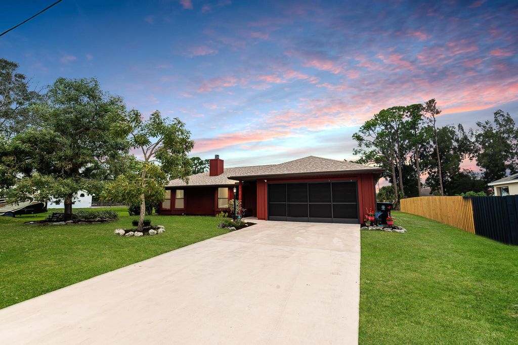 Photo of 1377 SW Axtell Avenue, Port Saint Lucie, FL 34953 (MLS # R10955530)