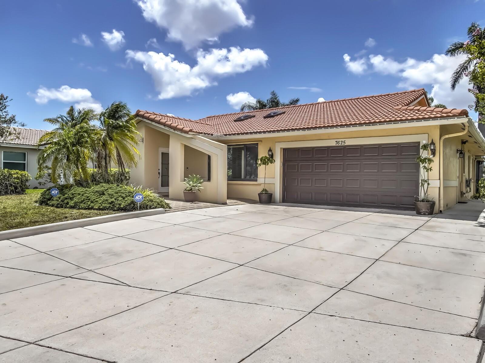 We're thrilled to present this lovely 4-bedroom, 2-bath home, offering breathtaking lake views and picture-perfect sunsets from your expansive screened and roofed patio. Experience the best of Florida living-ideal for family gatherings, holidays, and creating cherished memories. You'll be welcomed by vaulted ceilings and an abundance of natural light. The open kitchen and family room features S.S. appliances only 3 years, granite counter tops, and wood cabinets. Every window, door and garage door are high-impact, providing excellent protection and significantly reducing insurance costs. Other exceptional features include inside laundry room, parking for over 8 vehicles, cost saving sprinkler system off the lake, hot water heater 2 years, and flourishing mango, coconut, and avocado trees!