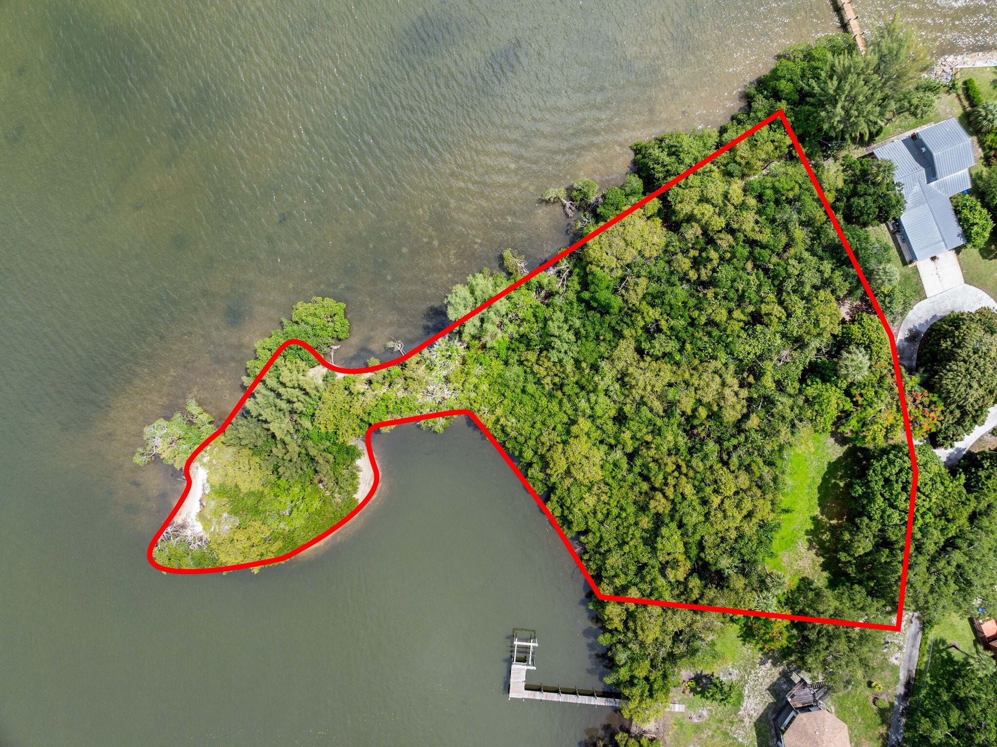 This is the only known property in Jupiter offering over 1,000 feet of private waterfront along the scenic Loxahatchee Rivercomplete with its own private island. A rare opportunity to own one of the most unique land parcels in the area, featuring 69,696 sq ft (1.6 acres) of land with 10,000+ sq ft already cleared and approx. 5,000-6,000 sq ft currently buildable (expandable with variances and mitigation).A DEP permit has been approved for a ~100 ft dock, and a certified expert has confirmed that mangroves on-site may be significantly trimmed to open views and improve usability. With direct access to the water, this property offers unmatched potential for a luxury estate or retreat.Located just minutes from 1000 North, The Woods, and the Love Street dining district, this propert