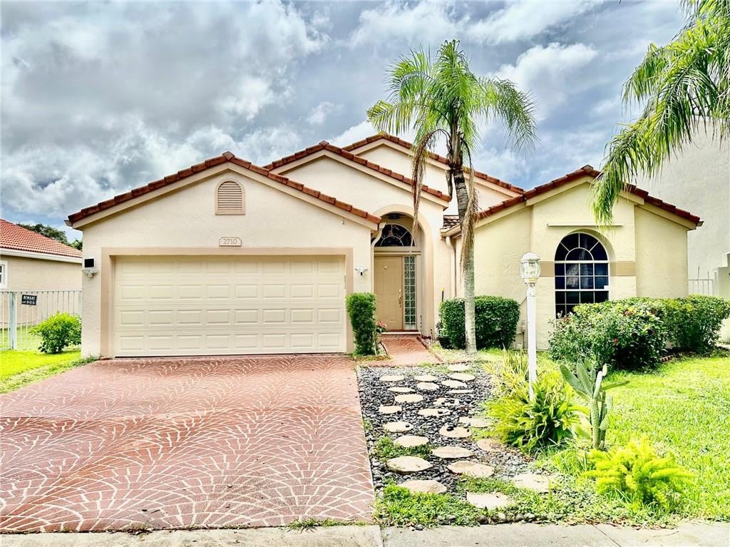 Photo of 2710 BOGOTA Avenue, Cooper City, FL 33026 (MLS # B26065210)