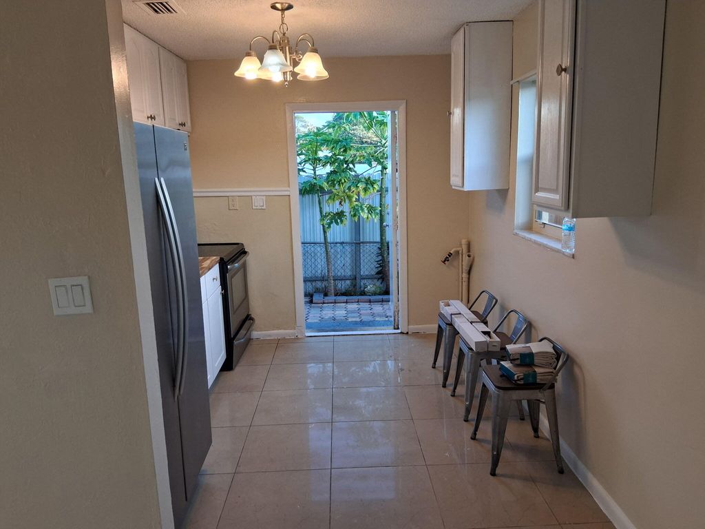 Photo of 420 Fleming Avenue, Greenacres, FL 33463 (MLS # B26008972)