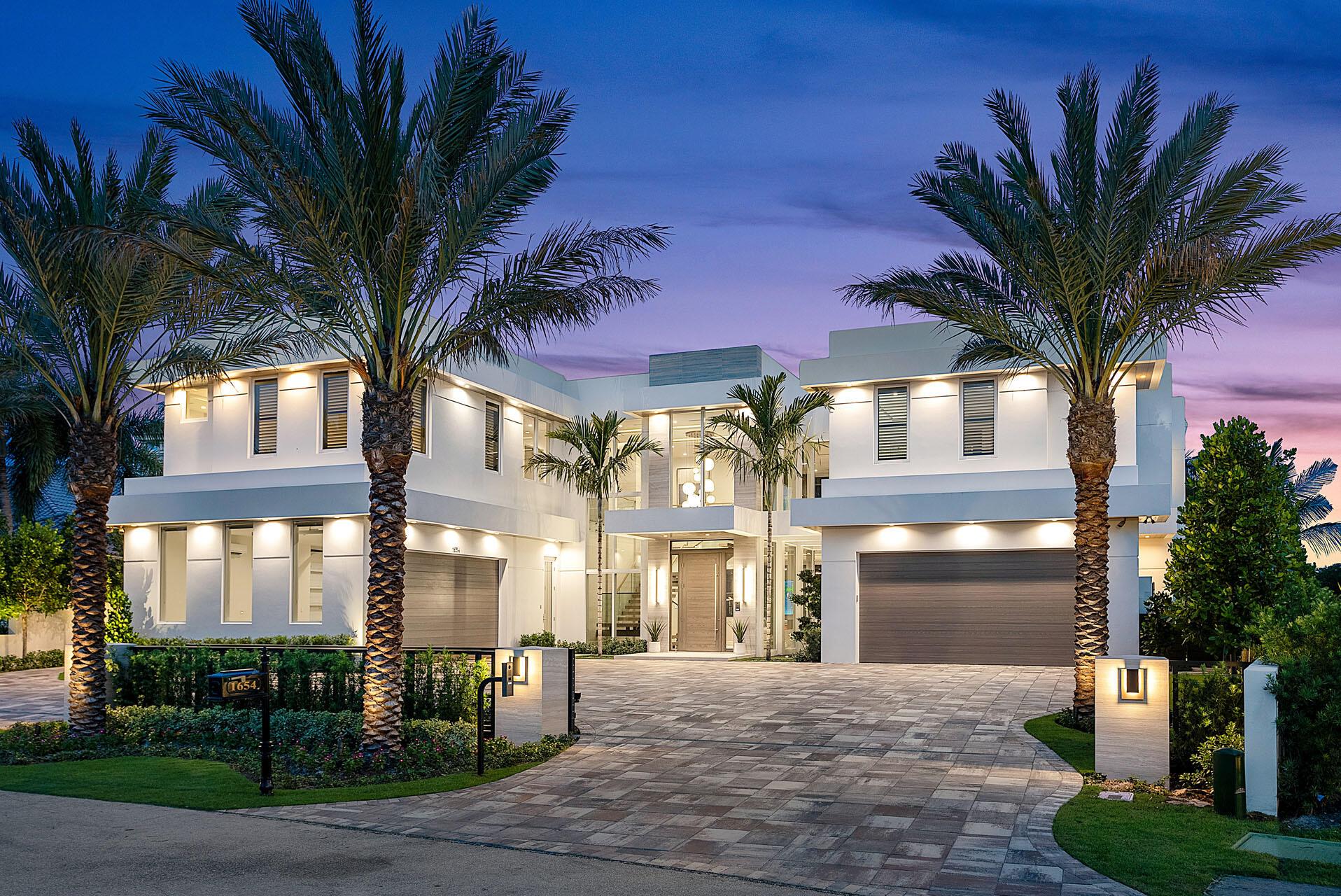 Welcome home to 1654 Sabal Palm Drive, a brand new extraordinary masterpiece crafted by SRD Building Corp. and furnished by the renown P&H Interiors. This prestigious Signature Estate takes golf course luxury living to new heights, commanding 132 feet frontage of stunning views of multiple fairways and the 13th green in the esteemed Royal Palm Yacht & Country Club. Embrace the grandeur of this turn-key home, encompassing over 8,800 sf of sheer living splendor. The 6 lavish bedrooms offer abundant space to accommodate family and guests. A trendy club room awaits, complete with a striking bar and wine room, setting the stage for unforgettable gatherings, and a dedicated study and multiple living rooms add sophistication and versatility to this impressive abode.